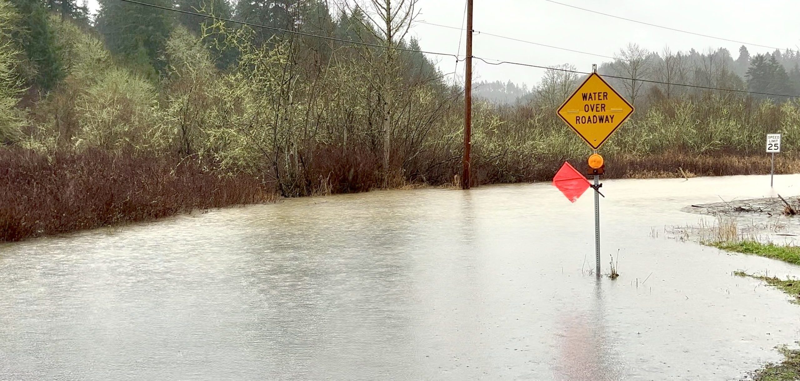 Entire roadway flooded.